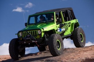 The Mopar Immortal was revealed at the 44th annual Easter Jeep Safari in Moab, Utah.  The Mopar Immortal is a Jeep Wrangler featuring portal axles, a 5.7-liter HEMI and off-road bumpers.  Military-grade portal axle ends are engineered to mate to Mopar’s Pro Rock and Power Wagon performance axles and adapted to fit the suspension.  Portal axle ends provide 5 inches of lift and contain a 1.5 gear reduction.  Combined with the 4:1 transfer case, the result is a 100:1 crawl ratio.  The vehicle is sheathed in Jeep performance body armor for protection.