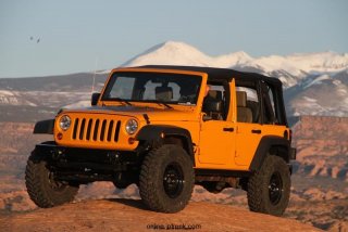 Mopar revealed the Jeep Wrangler J7 image vehicle at the 44th annual Easter Jeep Safari in Moab, Utah.  Built off of a four-door Jeep Wrangler Rubicon, the Jeep Wrangler J7 is designed to have the basic appeal of military-issued vehicles.  Mopar removed standard content including carpet, fog lamps, alloy wheels and the stereo system before adding front and rear steel bumpers, ‘helicopter hooks’, a heavy-duty tailgate and steel wheels.  Off-road capability is increased with a Mopar 2-inch suspension lift and 35-inch Mickey Thompson tires.  The unique Mustard Plug exterior paint is highlighted with Jeep Wrangler J7 graphics.