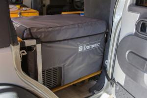 I added an insulated cover to my Dometic CFX-35 fridge which should help a lot in the heat of Africa