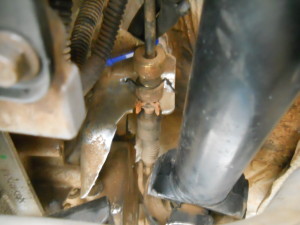 The JK transfer case cable and bracket reinstalled with the wire backup